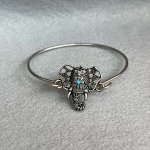 Intricate Silver Elephant Bracelet with Blue Accent